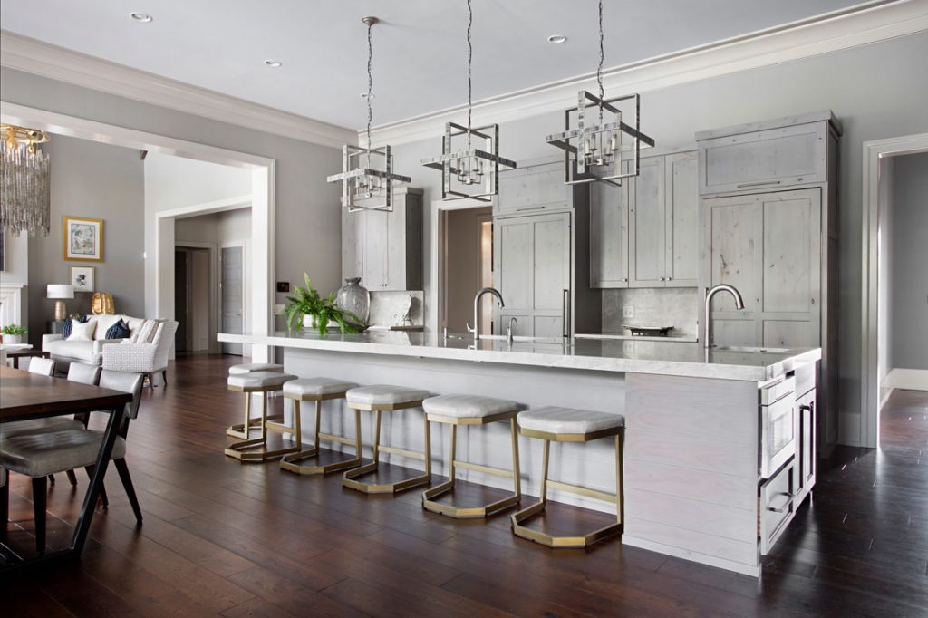 dark stained white oak live sawn hardwood floor in a white and gray kitchen